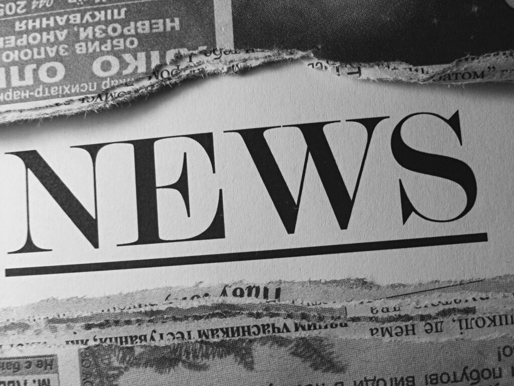 Black and white newspaper with headline "News"